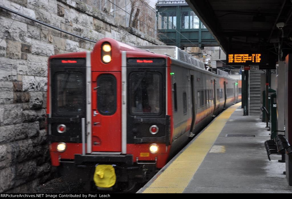 Outbound commuter approaches its station stop